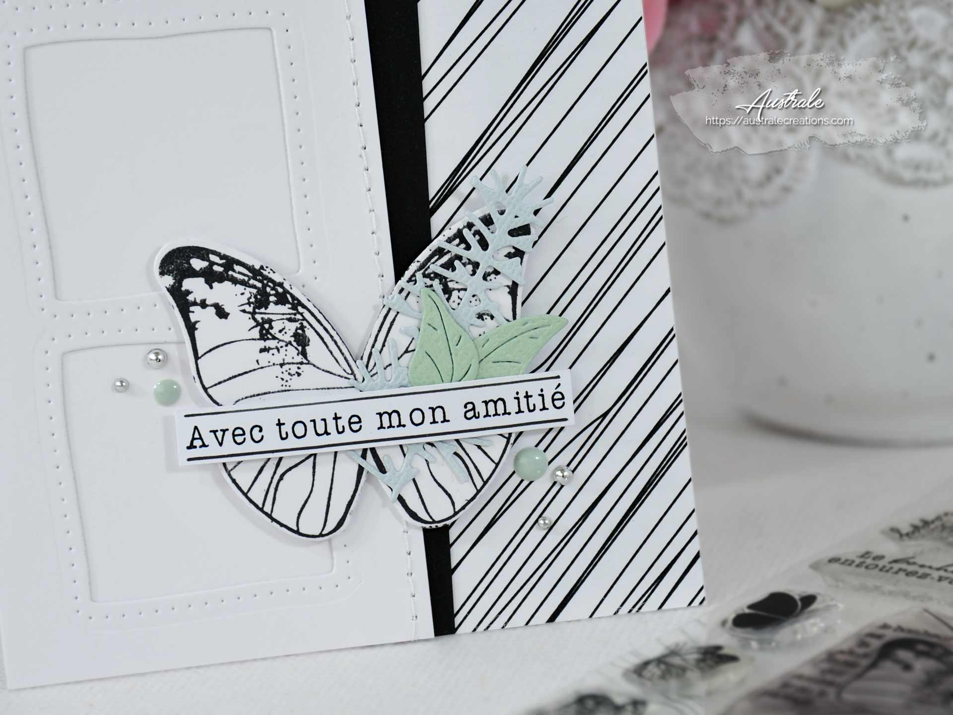 Création d'une carte d'amitié en noir et tons pastels avec feuillages et papillon.