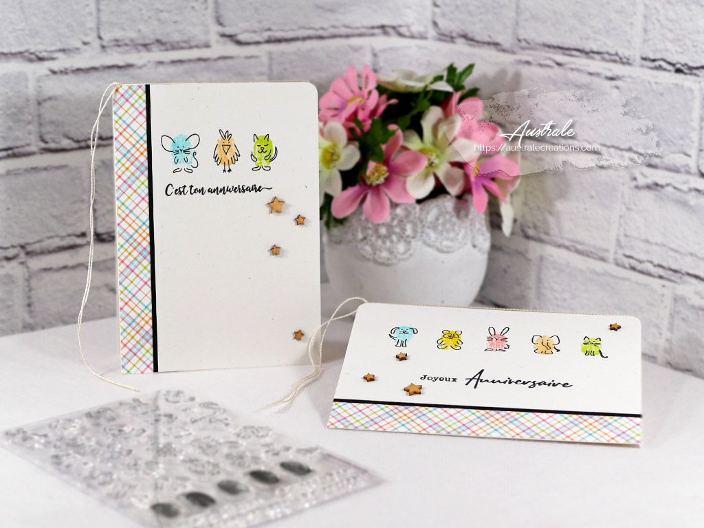 Création de deux cartes d'anniversaire pour enfants avec empreintes de doigts de petits animaux doodle dans des couleurs vives arlequin.