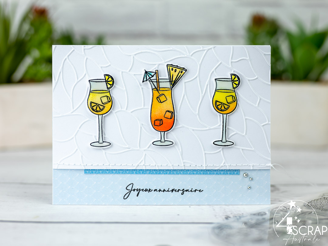 Création d'une carte sur le thème Tchin de 4enscrap. Elle est composée de 3 verres à cocktails sur fond texturé.
